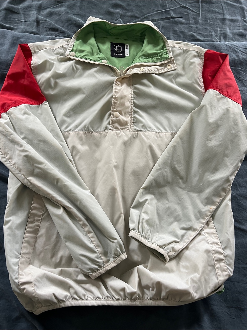 Original Use Cream Windbreaker with Red Shoulder Panels and Green Lining